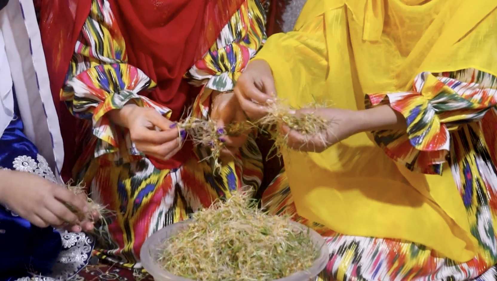 Women in traditional dress at the Samanak gathering, scene 6