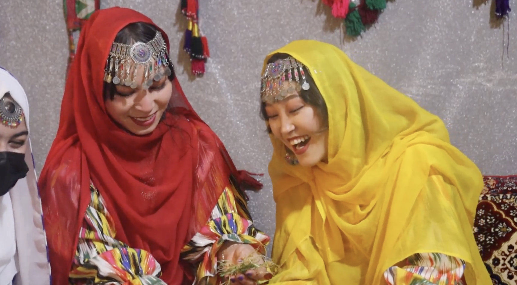 Women in traditional dress at the Samanak gathering, scene 5