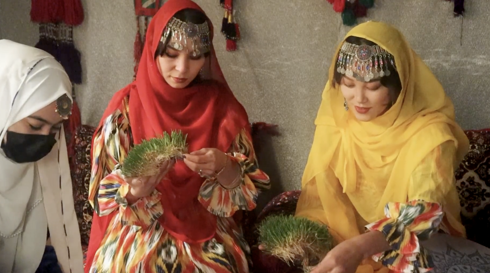 Women in traditional dress at the Samanak gathering, scene 4