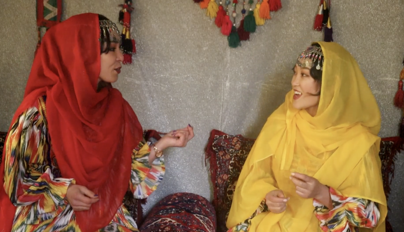 Women in traditional dress at the Samanak gathering, scene 3