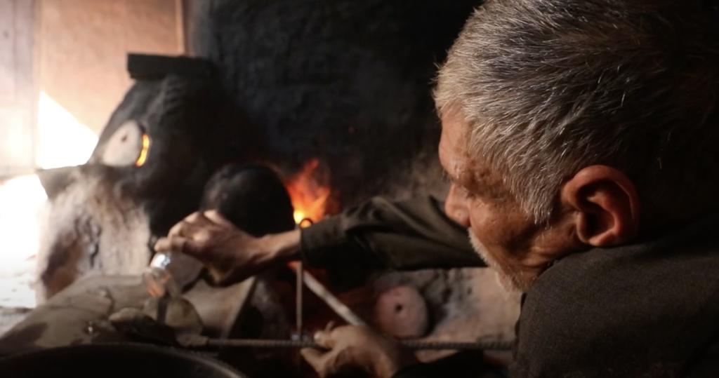 Herat glassblowing at the furnace
