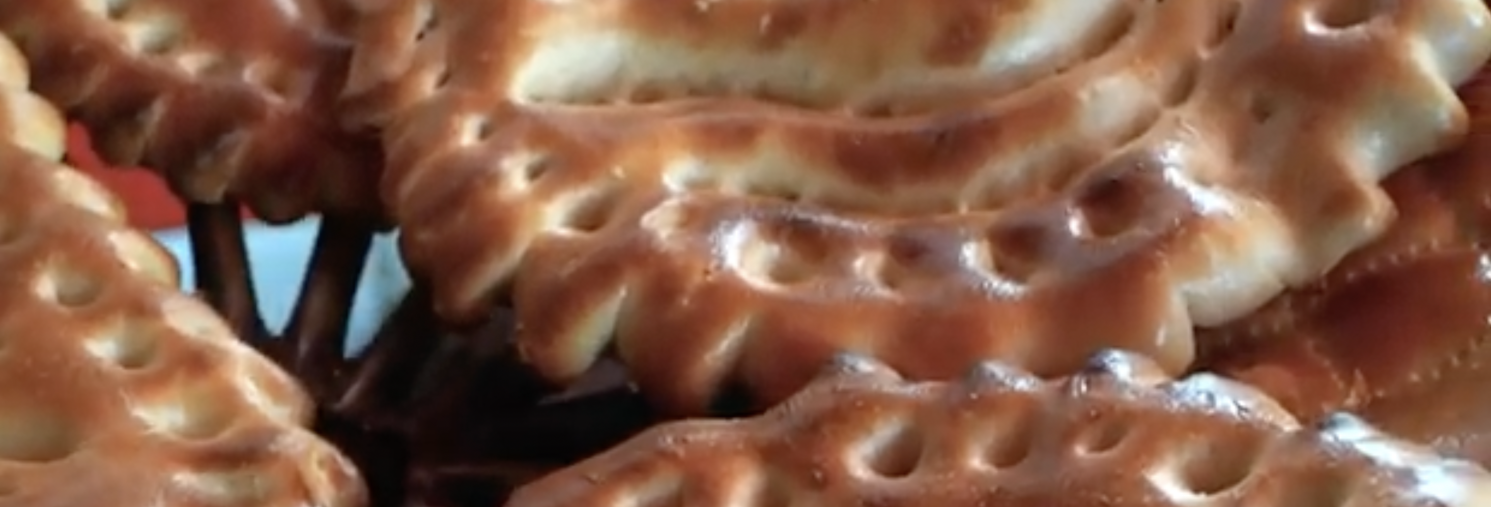 Baker shaping flatbread dough