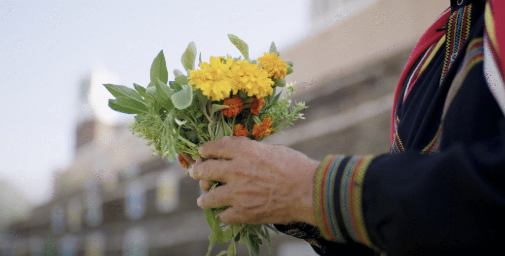 Flower Men of Aseer: a garland of marigolds and fresh herbs