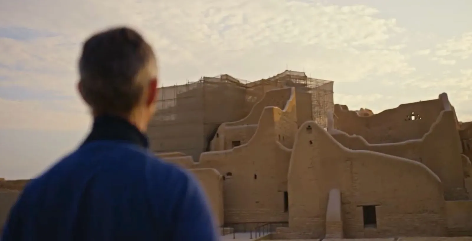 Historic mud-brick walls of At-Turaif in Diriyah, Saudi Arabia, illuminated by warm evening light