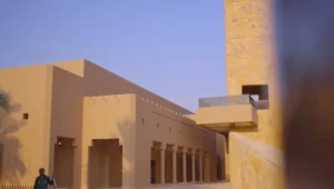 Historic mud-brick walls of At-Turaif in Diriyah, Saudi Arabia, illuminated by warm evening light