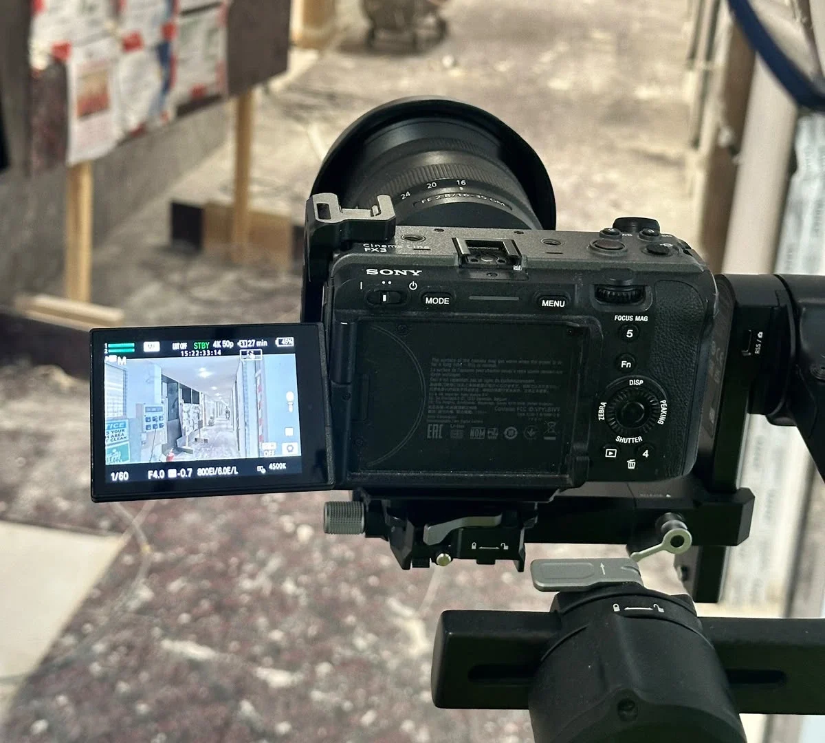 A professional cinema camera rigged and positioned on site for filming an office fit out transformation project.