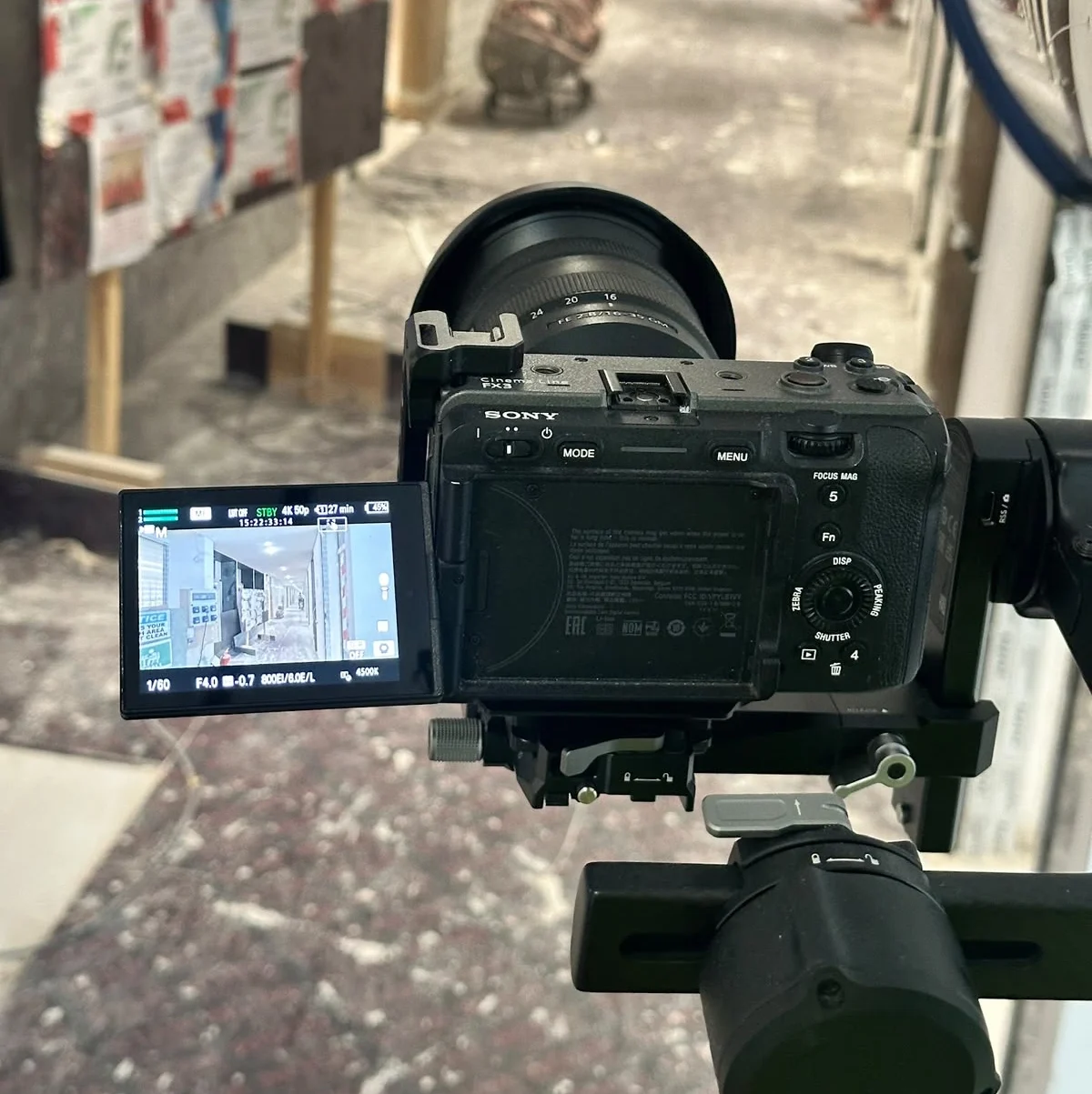 A professional cinema camera rigged and positioned on site for filming an office fit out transformation project.