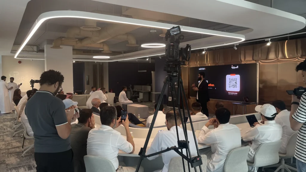 Stock Stop camera operator filming the audience at Sabtiah in Riyadh