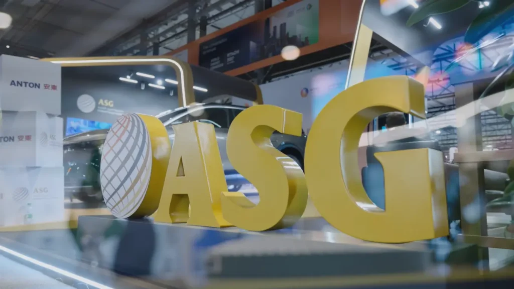 Large yellow ASG logo displayed at the Al Sharif Group exhibition booth during the 25th WPC Energy Congress in Riyadh.