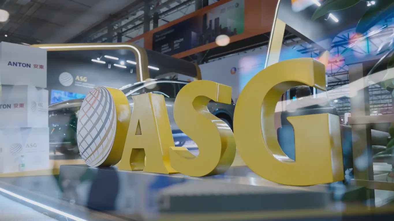 Large yellow ASG logo displayed at the Al Sharif Group exhibition booth during the 25th WPC Energy Congress in Riyadh.